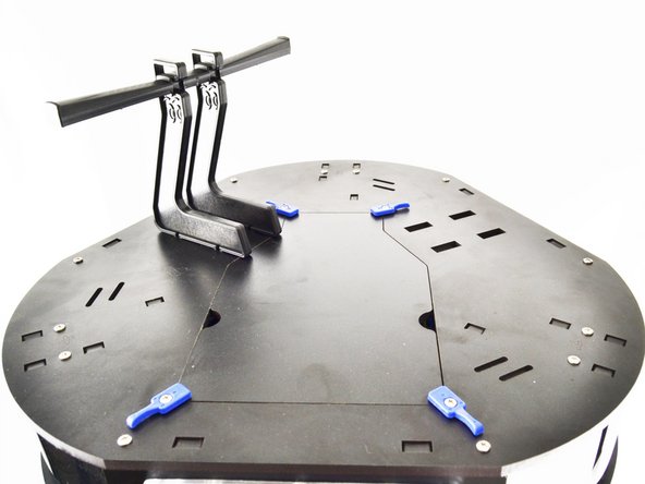 Slide the spool holder assembly towards the outer edge of the printer, locking it in place.