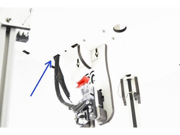 In the pictures I show two locations. The location with the blue arrow shows where the original whip was routed.