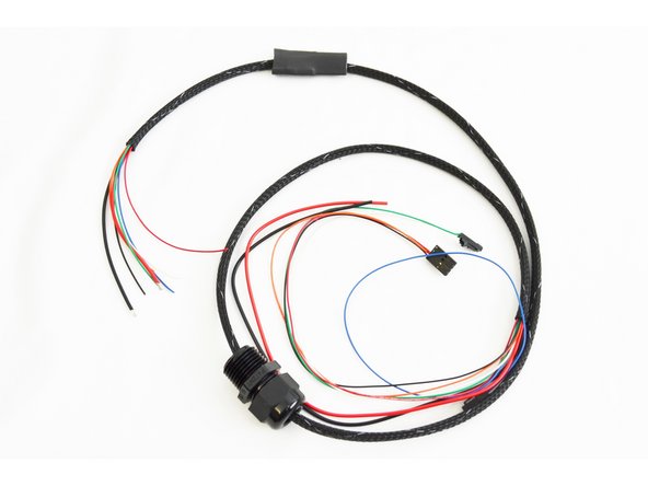 Insert the heat shrink tubing that you stretched in the previous step onto the whip. The stretched out portion should be facing the end of the whip without any terminated wires.