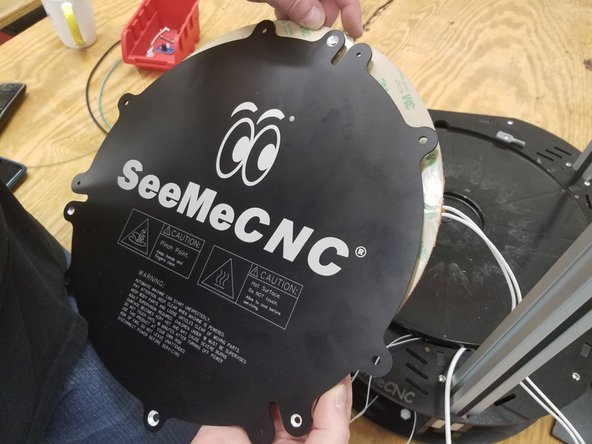 Clean the back of the aluminum heat spreader with alcohol and a paper towel.