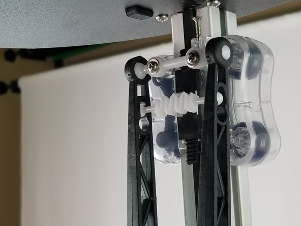 Insert the springs into the arms.  There is a large hole near the ends of each arms for the springs.