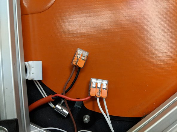 Install the two white wires in the open positions on the Wago connector with the red wire.