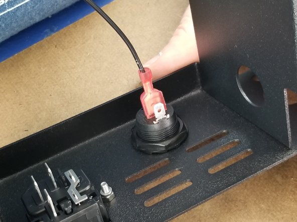 Press one of the spade connectors onto the rocker switch.  Press the spade connector on the leg of the switch that is in the center of the switch as shown in Pic 2.