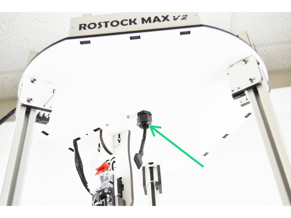The location with the green arrow is where I chose to route the hot end whip. (note.I used a panel mount strain relief, not included)