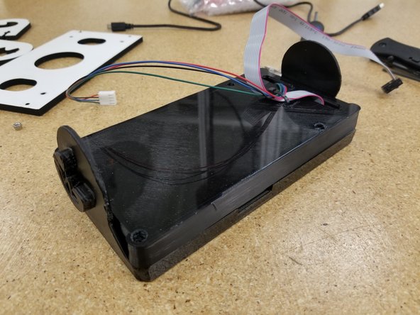 Align the two halves of the bezel enclosure, making sure that the SD card notch on the front enclosure half is aligned with the SD card slot on the screen.