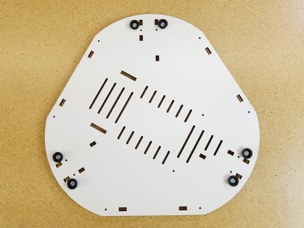 Install the included rubber bumpers on the feet.