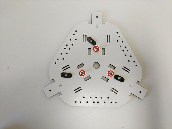 Locate the top assembly base plate (shown in image), (3) 1/4-20 button head screws, and (3) TSLOT nuts.