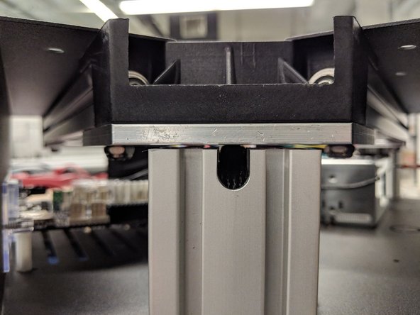 Ensure that the end-stop legs are bent over at a 45 degree angle as shown in the picture. Check at all 3 tower locations in the upper assembly.