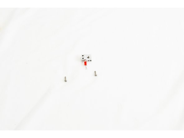 Insert the heater cartridge into the side of the heater block. The leads of the heater cartridge should stick out of the side of the heater block with 3 holes. The leads should be in a horizontal orientation and NOT VERTICAL. The heater cartridge should be inserted so that it is flush on the opposite face of the heater block.