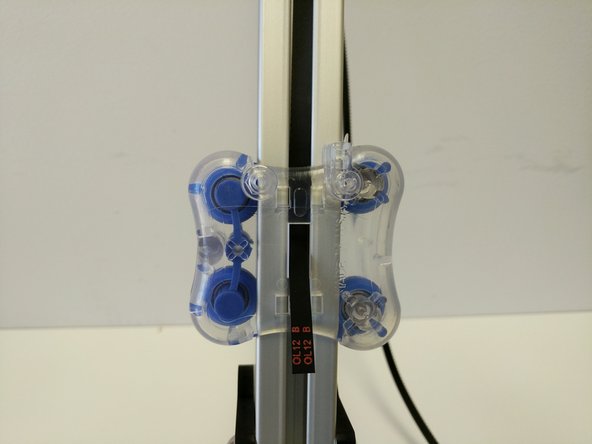 Start by feeding the belt between the carriage and TSLOT (at the top of the carriage) and through the rectangular opening in the center of the carriage.