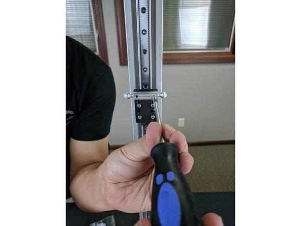 Flip the printer back over and put it on a work surface. Team lifting may be required, as the printer is heavy.