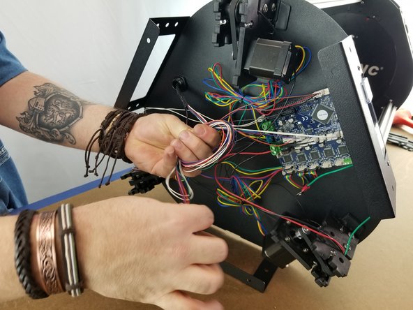 With these wires plugged in, bundle the slack of the wires together as shown in Pic 2 and zip tie them together to bundle them and clean the wiring.