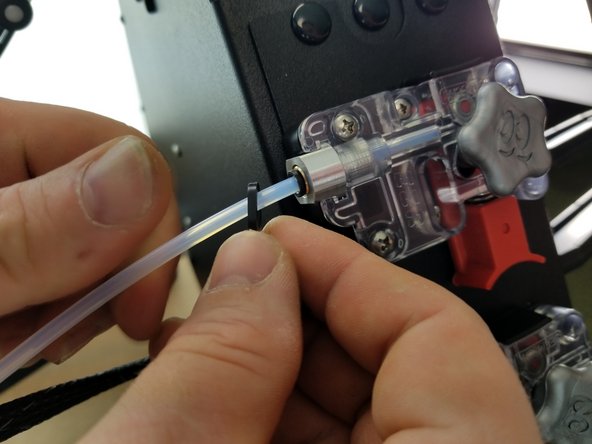 Insert the PTFE tube into the PTC fitting on the EZR Struder. Make sure it's pushed all the way through until it stops.