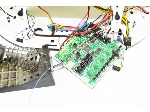 Slide the heat-shrink up over the connection that you soldered and heat it with a lighter.