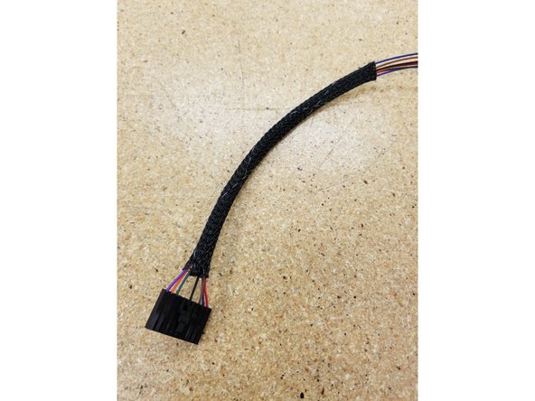 Pass the wires through one of the shorter lengths of mesh loom material.