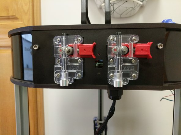 Install the new extruder plate on the side of the machine using the original 10-32 fasteners.