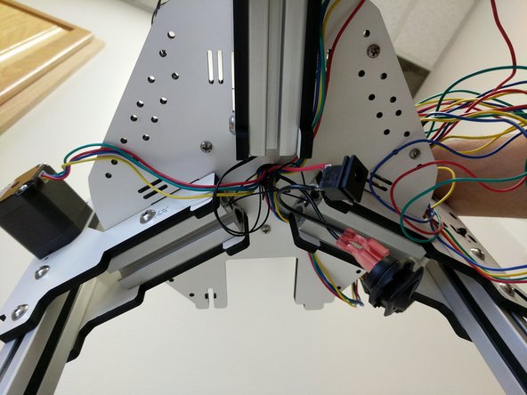Route the red and black 18awg power wires through the base plate. The wires will come up under the Mini-RAMBo board.