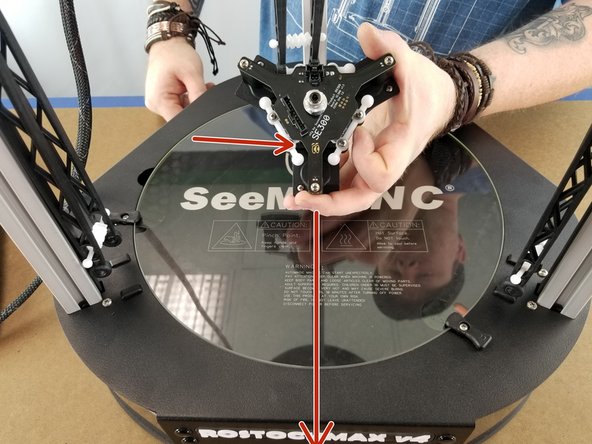 Insert the spring in the other end of the arms as well and let hang as shown in Pic 2.