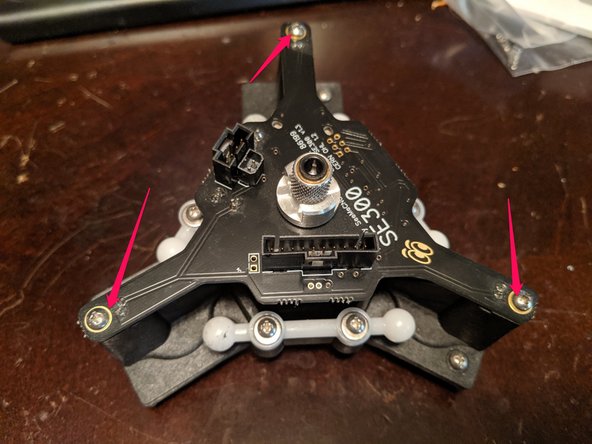 Remove the 3 screws holding the SE300 board to the platform.  These are shown in Pic 1 with red arrows.