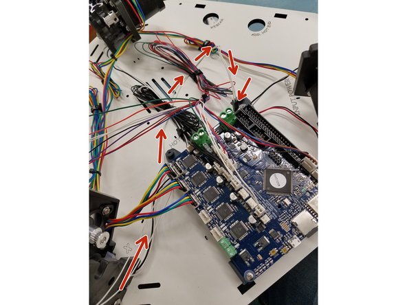 The Bed Thermistor can be ran as shown in the pictures. If your Bed thermistor leads are not long enough to make that travel. You can just run it over the board and plug it in.