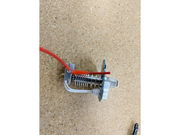 Strip ~4mm of insulation from the lead you just trimmed.