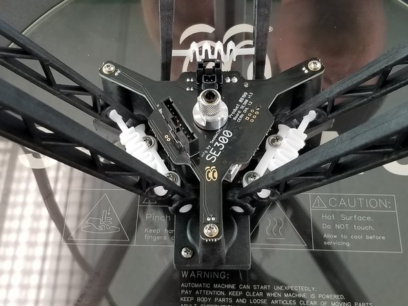 Repeat this process for the other two towers to fully attach the hotend to the arms.