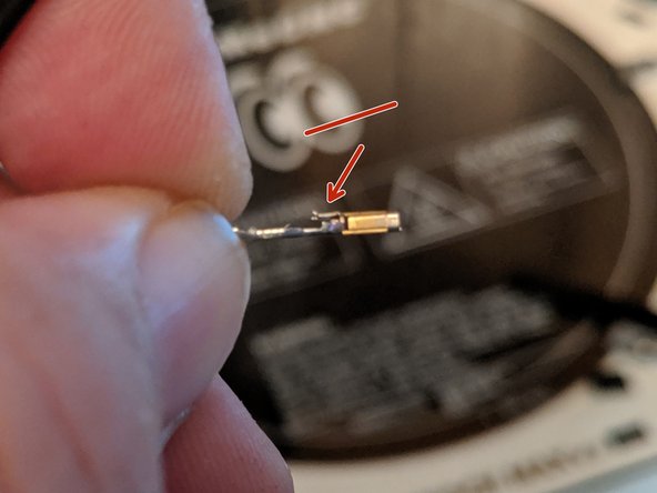 Pic 2 shows the tab on the metal connector that has been depressed in order to remove it from the plug.