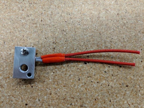 First remove the nozzle (should only be on finger tight when taken from the kit).  Then unscrew the heater block. Finally unscrew the heat break.  You should have 4 seperate pieces.