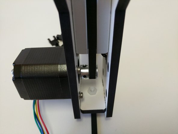 When you get to the bottom of the tower assembly route the belt around the timing pulley.