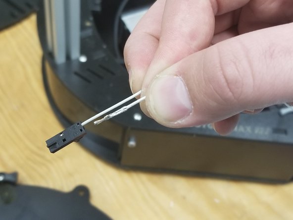 Strip about 5mm of the existing white 26awg thermistor wires exiting the Y tower (that you snipped from the old bed)