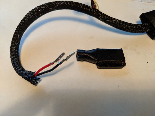 With both wires crimped, you will get the rubber boot for the new plug as shown in Pic 2.