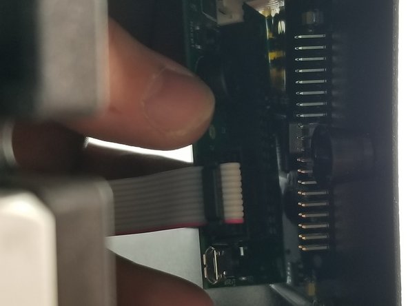 Line up the black housing on the control board with the row of pins on the back of the touch screen control board.