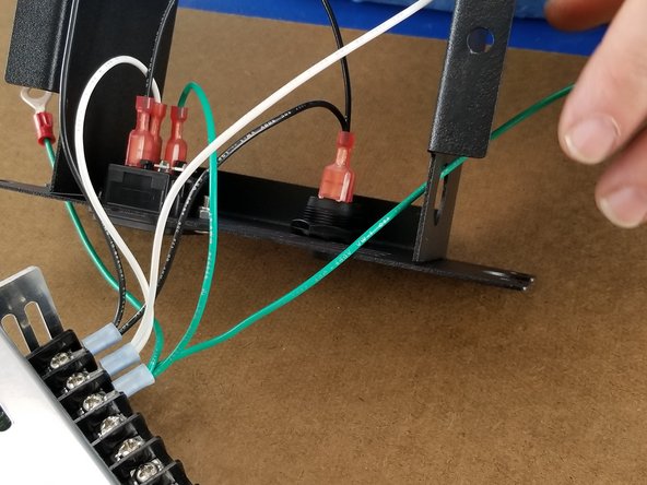 Route the long green wire out the hole on the front side as shown in Pic 3.