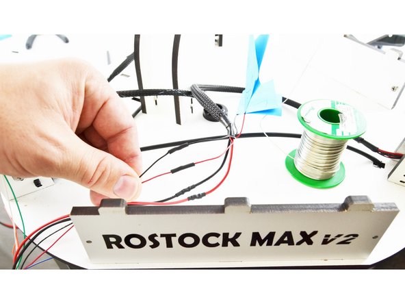 Slide the heat-shrink up over the connection that you soldered and heat it with a lighter.