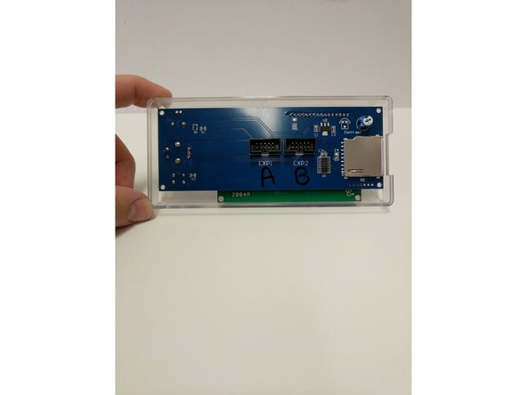 Insert the LCD controller into the enclosure front case. The SD card reader on the right side will line up with the recess in the enclosure.