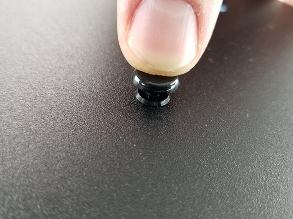 Pres the top of the rivet to lock them into place and secure the power supply bracket to the sheet metal plate.