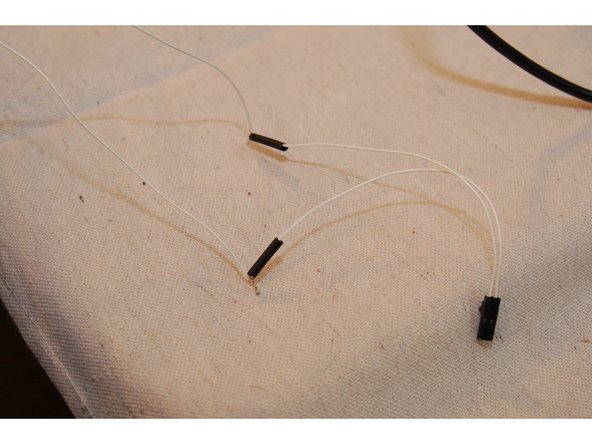 Cut about 3&quot; off the thermistor leads from the connector end. You'll be soldering this end to the thermistor leads that are coming out of the X tower.