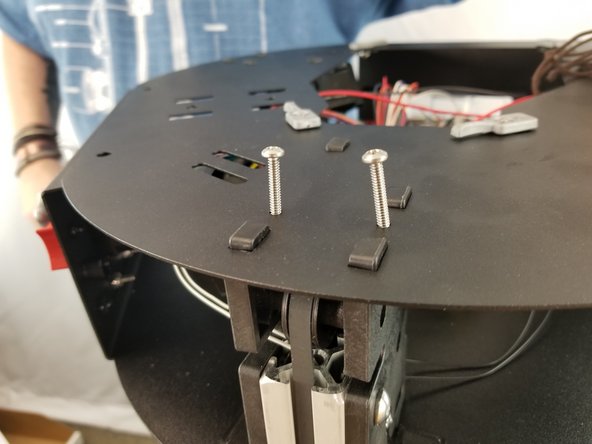 Locate the screw holes on top of each motor mount bracket and insert the screws in the holes as shown in Pic 2.