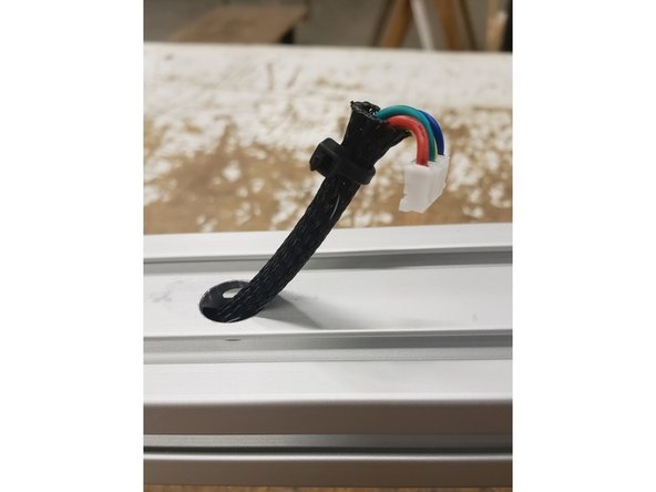 This step is generally easier with the machine on its side. We are attaching this assembly to the Y-tower, so it will be facing up.