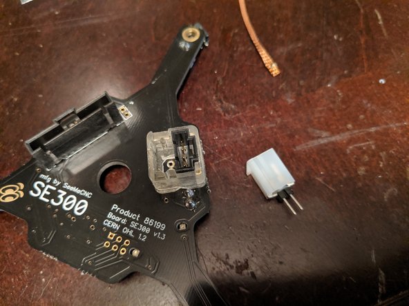 Place the ring over the 4 pin connector remaining on the hotend board as shown in Pic 2.  This will be a tight fit but should slide over the 4 pin.
