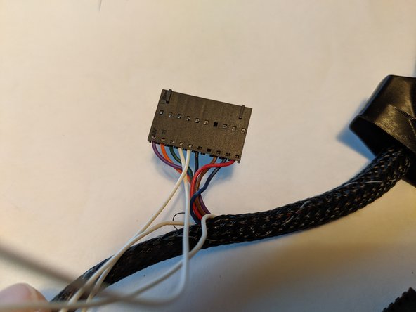 The tab you previously lifted on the thermistor wires will face the side of the plug with the windows in order for it to slide fully in and lock into place as shown in Pic 2.  You will hear an audible click when fully inserted.