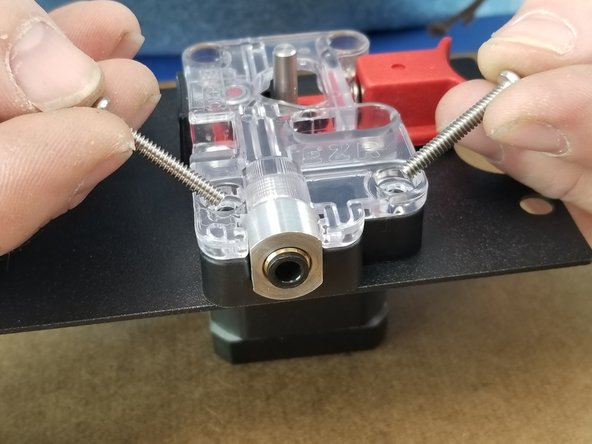 Using the 6-32 x 7/8&quot; long screws, insert them in the two upper holes of the ezr struder.