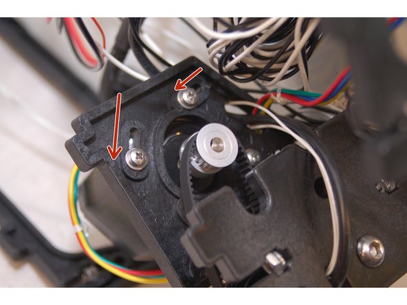 Rotate the stepper motor to the position shown in the photo. This location will give you the most available range of motion for tightening the belts after they are installed.