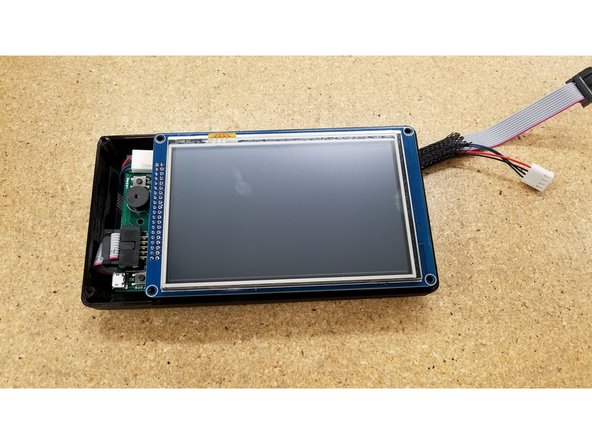 Be sure that the back enclosure half is oriented as seen in the photo, using the board standoff posts as a reference point.