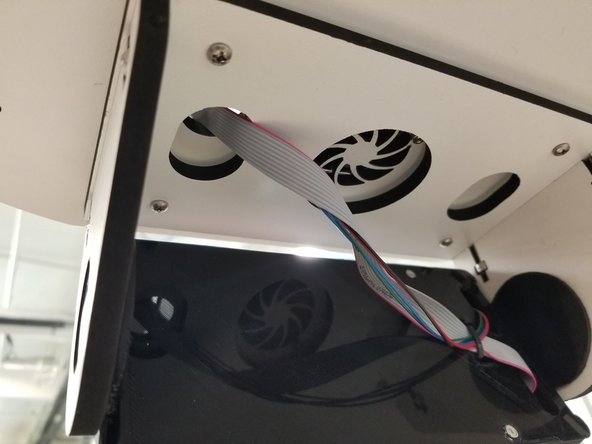 Route the cables through the pre-cut  hole as shown.