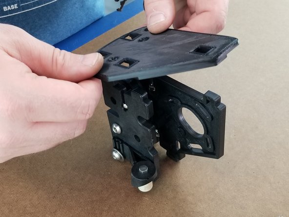 Take the big shim plate and place it on the assembled bracket on the side opposite of the PEEK insulator.