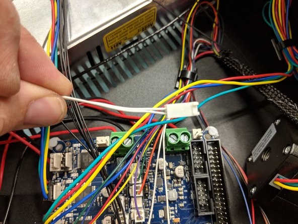 The bed thermistor connector (2-pin with 2 white wires, exiting the Z tower wire bundle) is keyed and will only plug in one direction in the location shown in the photo.