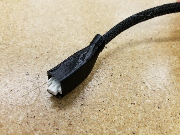 Zip tie the two cable bundles together at the top of the mesh looms as shown.