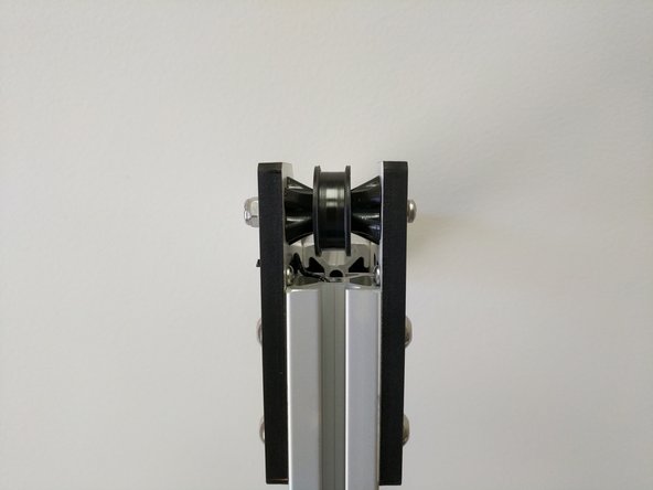 Assemble the components as shown in the image. Do not fully tighten the 6-32 hardware at this time.