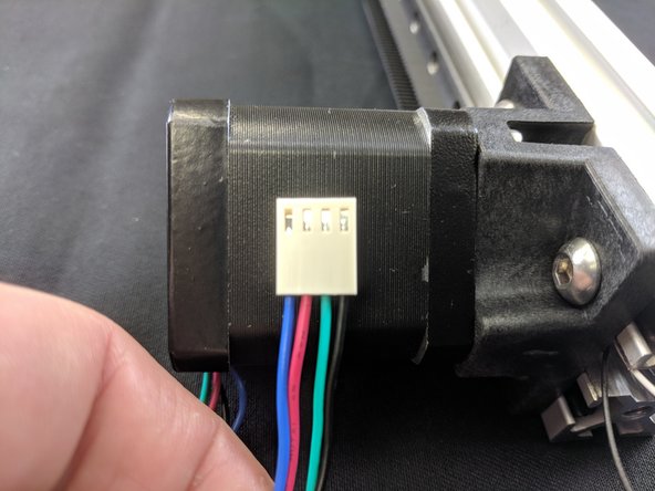Machines AFTER 3/20/2018: Motors can have a black connector and different color wiring, They are connected with the smooth side of the plug towards the edge of the Duet.